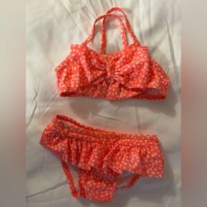8 to 12 month two piece swimsuit new with the plastic tags..